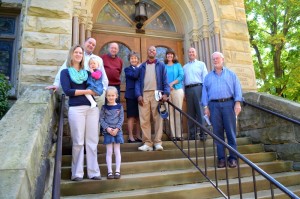 Members gather at the main sanctuary door on a beautiful, sunny morning.